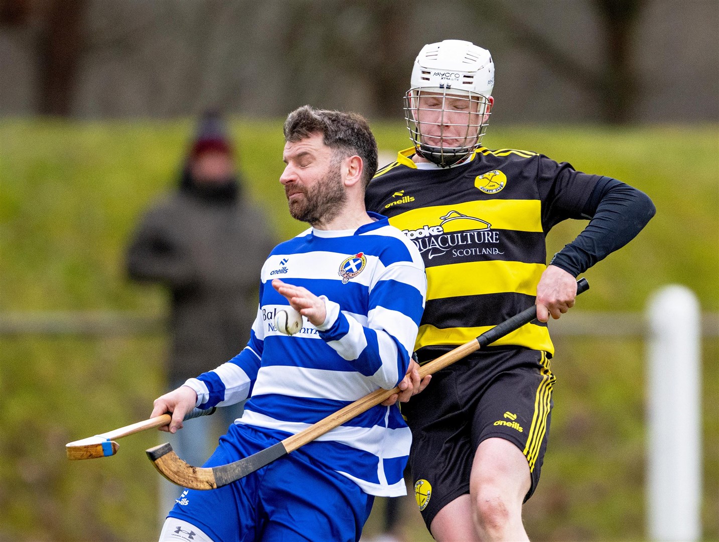 Newtonmore's Drew Macdonald hides the ball from Murray McClymont (Col Glen) during the Blue and Whites’ first pre-season friendly which ended with a 3-0 win over Col Glen.
