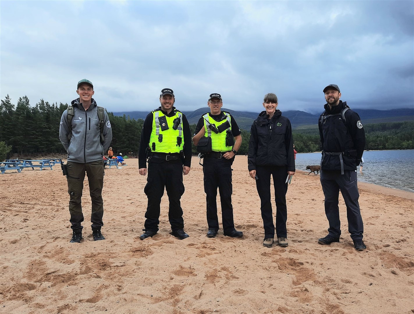 Rangers from the Cairngorms National Park Authority (CNPA), Forestry and Land Scotland (FLS) and officers from Police Scotland on patrol at Loch Morlich last summer.