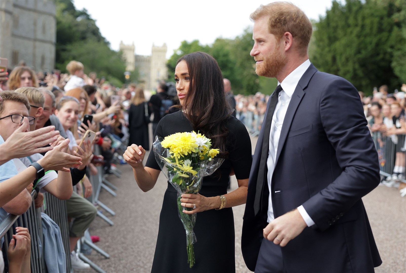 Harry and Meghan met members of the public as they viewed the floral tributes at Windsor Castle on Saturday (Chris Jackson/PA)