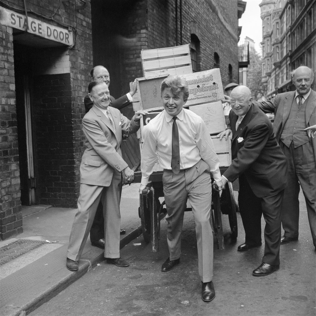 Tommy Steele helping set up a press conference for the Festival of the City of London (PA)