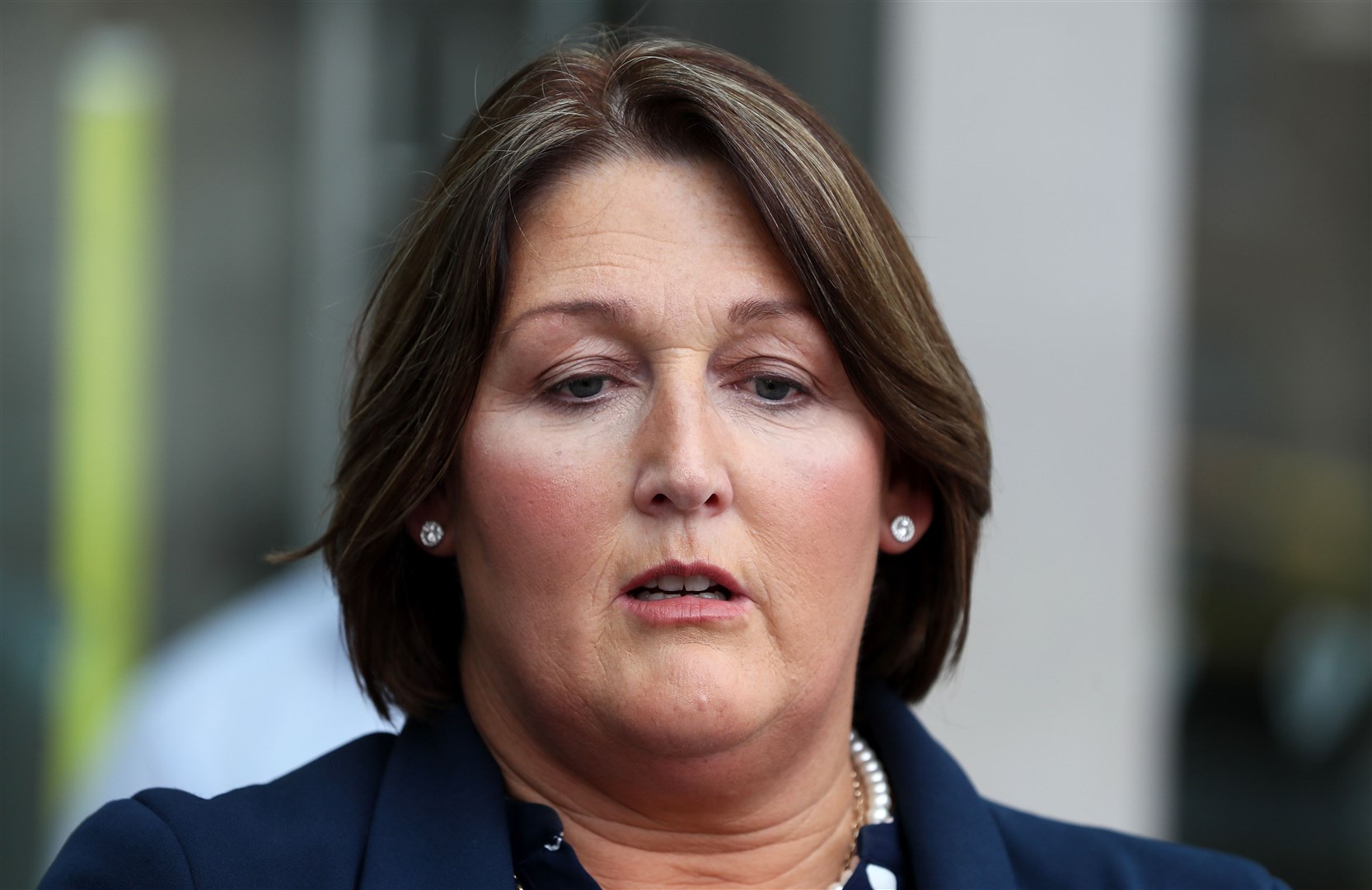 Caroline Donohoe, the widow of Adrian Donohoe, speaks to the media outside the Criminal Courts of Justice after Brady was convicted (Brian Lawless/PA)