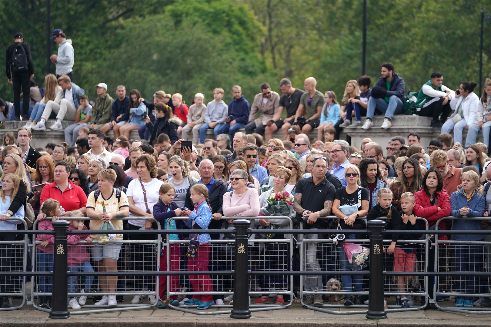 Crowds gather for the arrival of King Charles III at Buckingham Palace after the Accession Council (Zac Goodwin/PA)