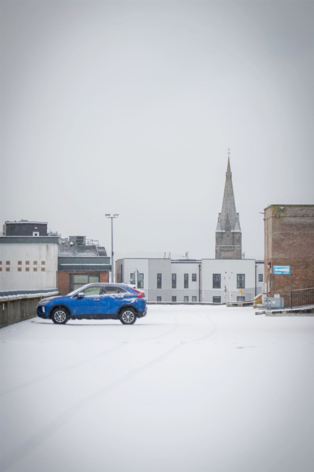 A solitary car parked on the top storey at the Rose Street car park in Inverness.