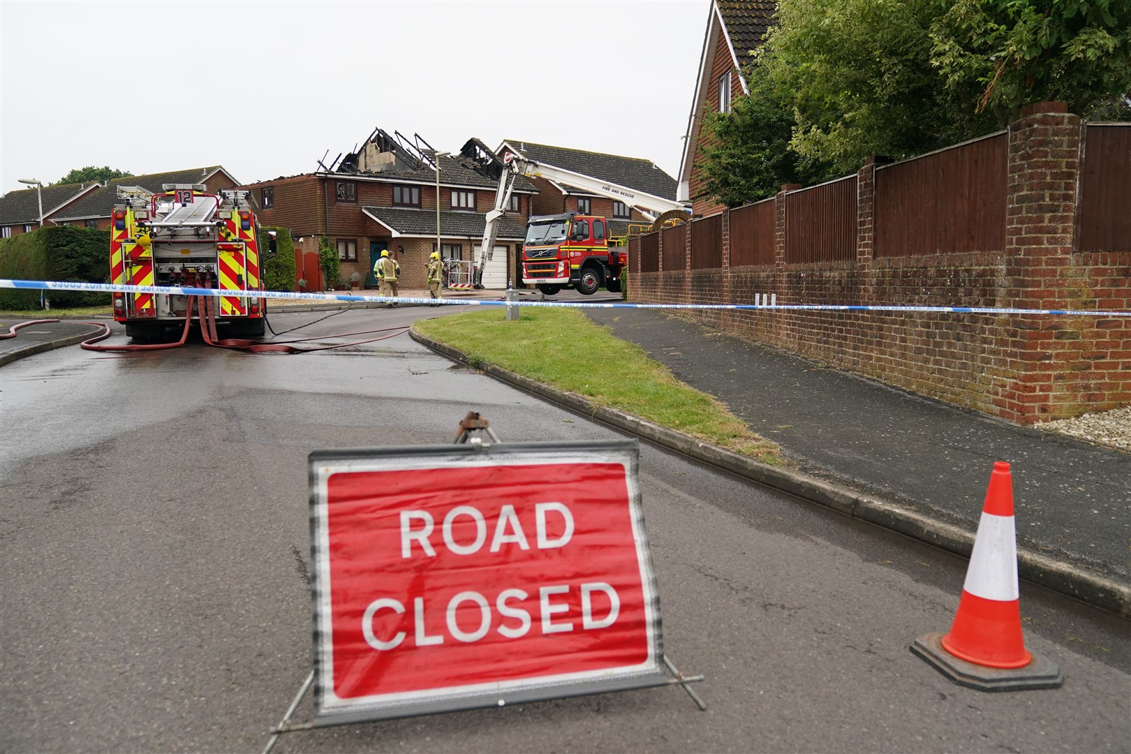Firefighters remain at the scene of the incident (Andrew Matthews/PA)