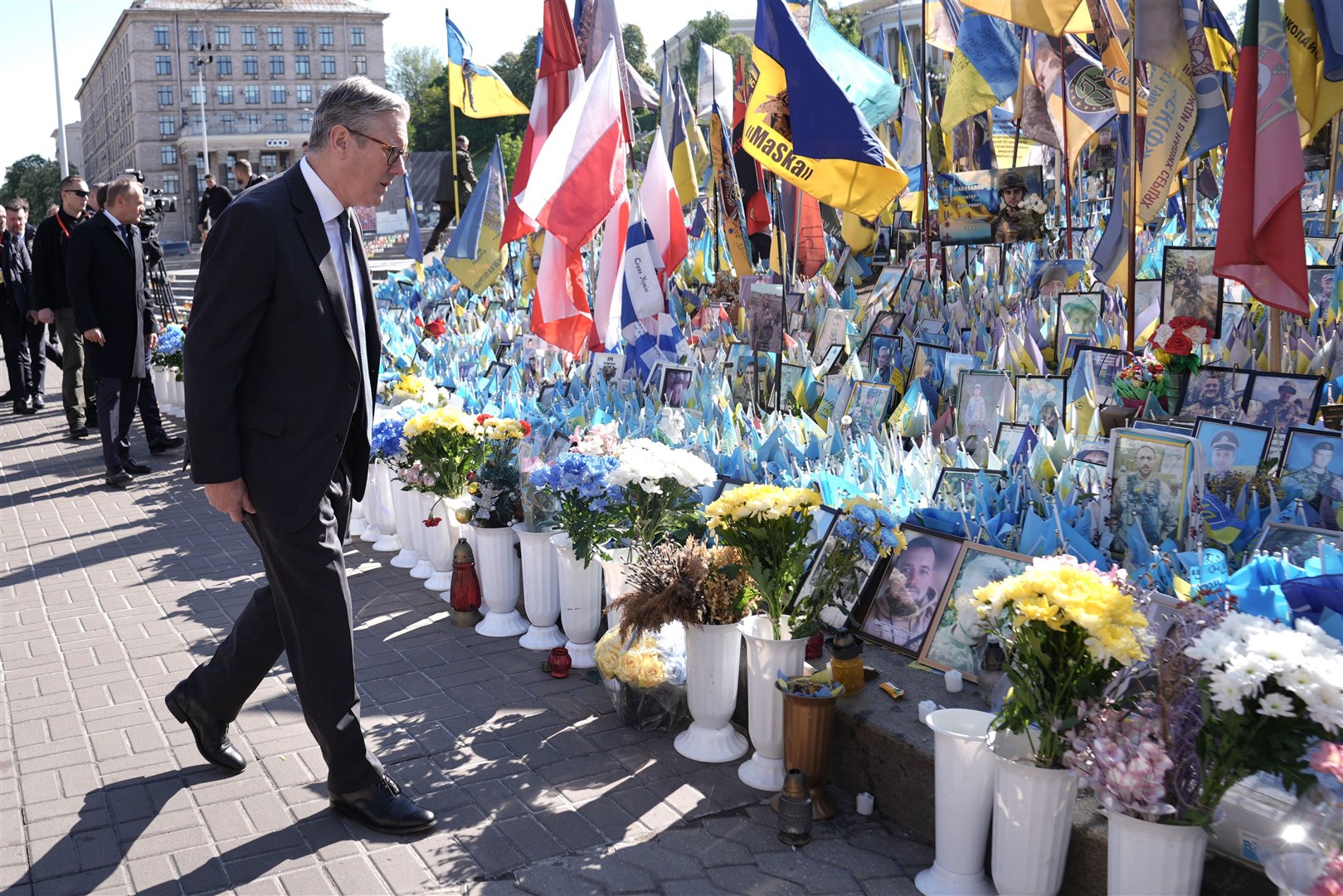 Prime Minister Sir Keir Starmer looking at tributes to fallen soldiers in Maidan Square (Stefan Rousseau/PA)
