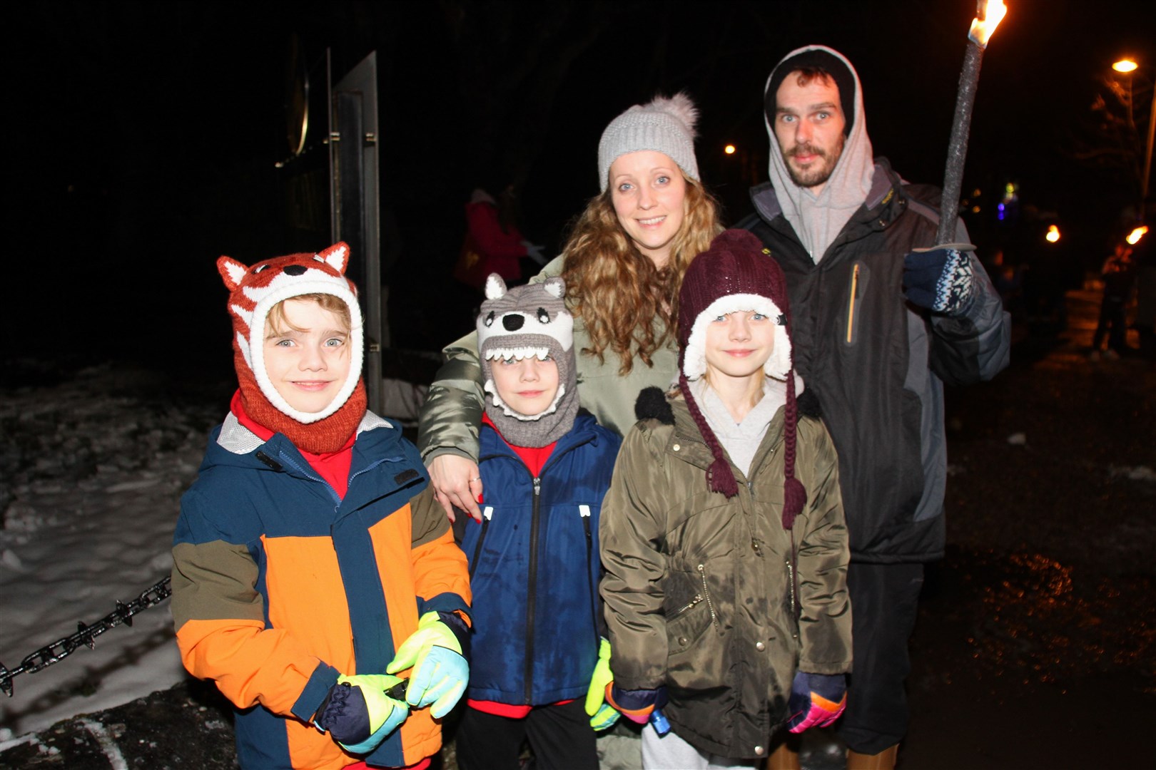 Abbie and Paul Howard at Grantown's torchlight parade with Isla, Freddie and Max.
