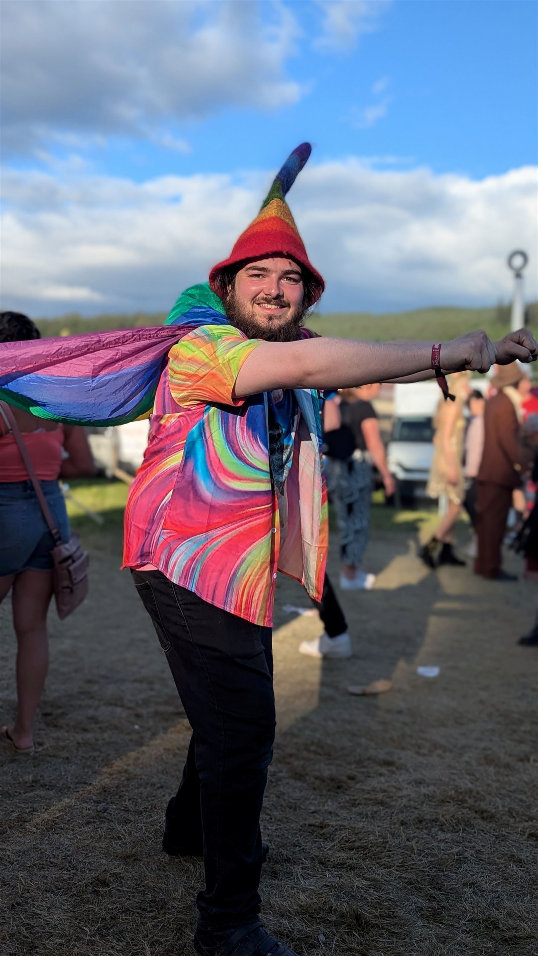 One man dressed as a rainbow superman.