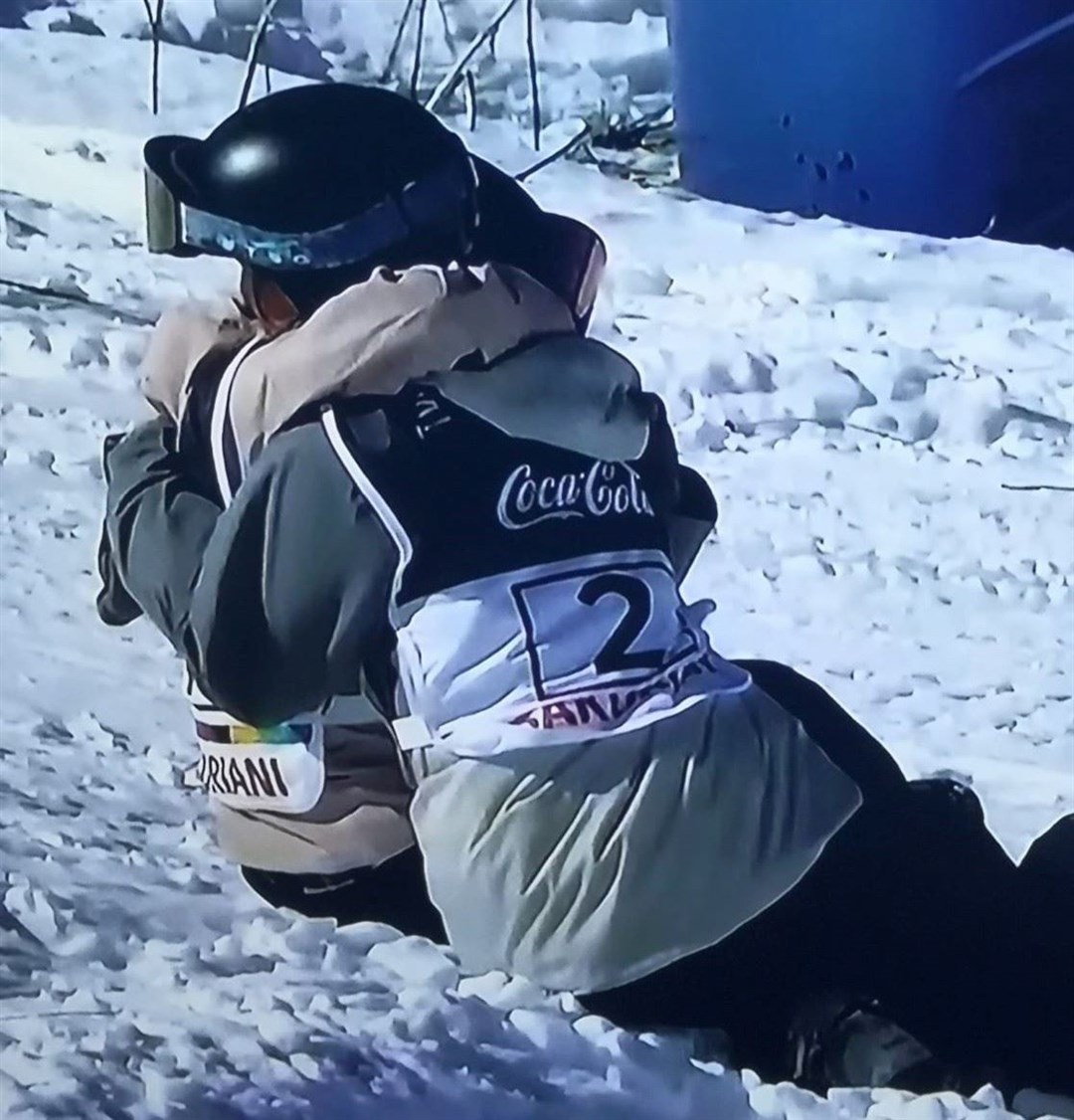 CONSOLATION HUGS: Emily Rothney and Swiss fellow faller Lura Wick console each other after shared disappointments