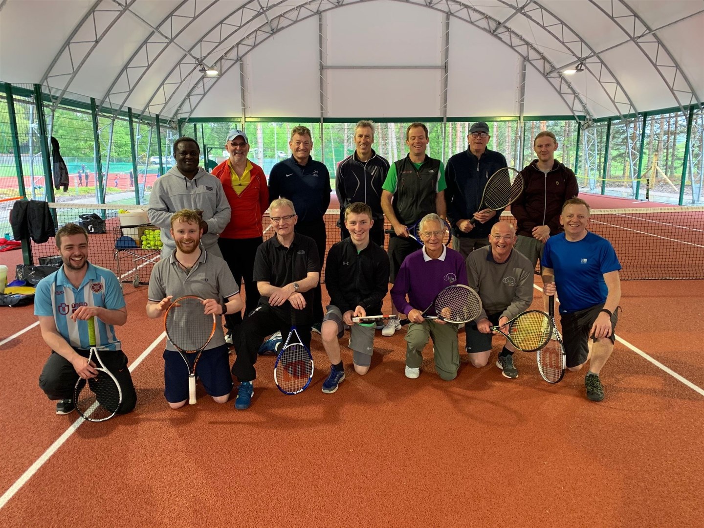 The men were able to keep dry for their coaching session even in the heavy rain.