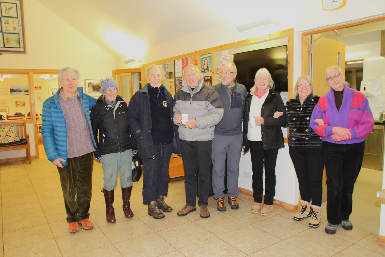 Tim Walker (centre) with friends at Boat of Garten's community hall.