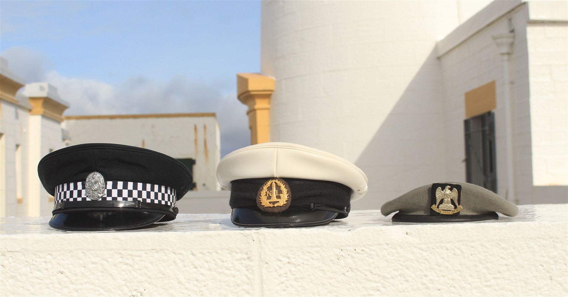David has kept these three caps representing different phases in his working life – in the police force, the lighthouse service and the army. Picture: Alan Hendry