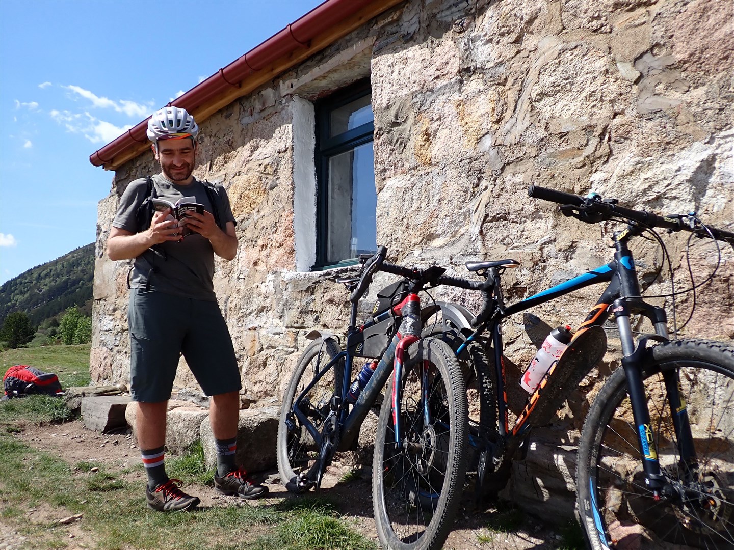 Markus Stitz thumbs a copy of his new book outside Ryvoan bothy. Picture: John Davidson