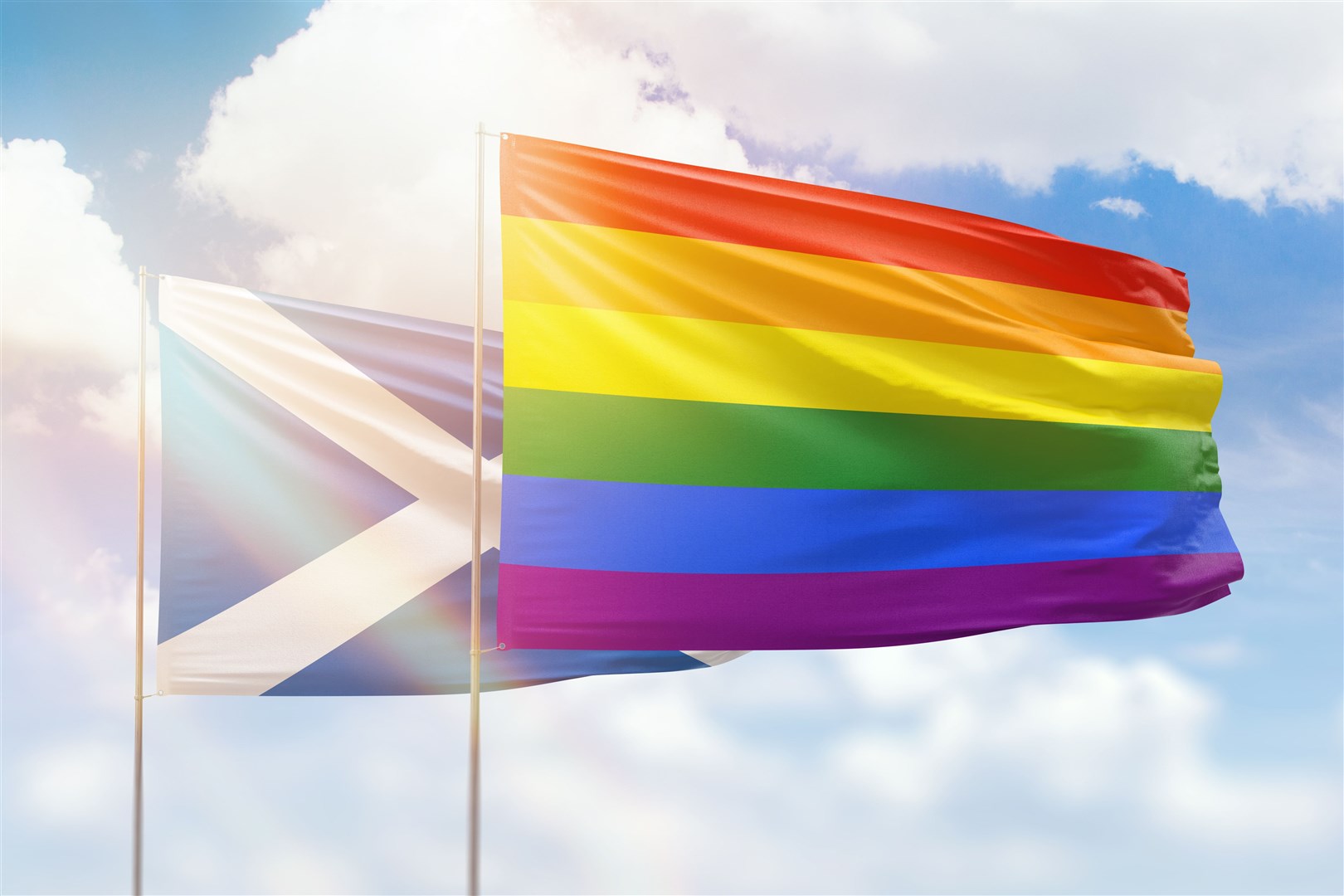 A Pride flag for the LGBT+ community and a Scottish flag side-by-side.