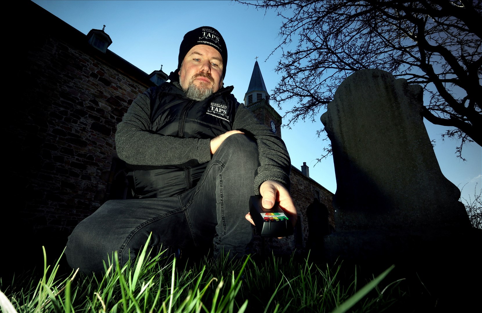 Liam Shand, co-founder of Highland Paranormal in the grounds of Old High Church with a K II Meter. Picture: James Mackenzie.