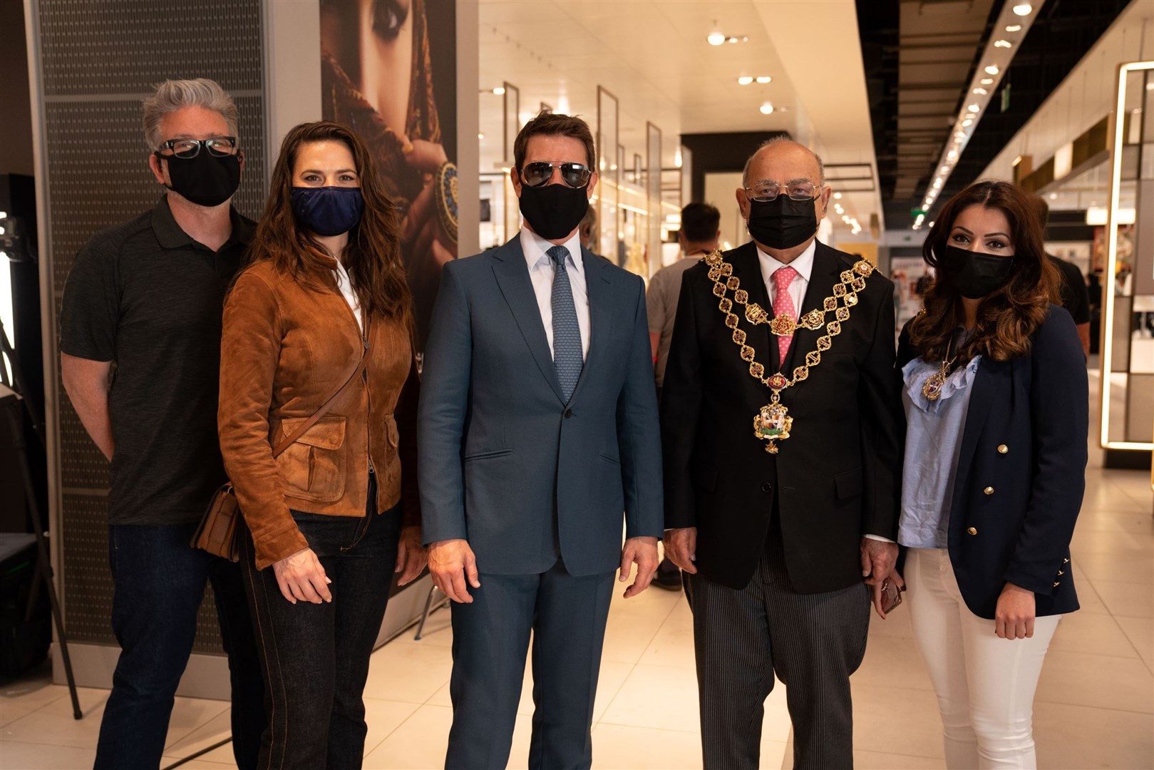 Tom Cruise with Mission: Impossible 7 co-star Hayley Atwell and director Chris McQuarrie posing for a photo with Muhammed Afzal, Lord Mayor of Birmingham, during a break from filming at Birmingham New Street station (Lord Mayor of Birmingham/PA)