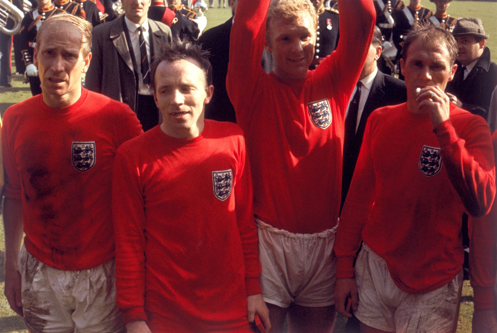 Exhausted England players Sir Bobby Charlton, Nobby Stiles, Bobby Moore and Ray Wilson after the 1966 World Cup final (PA)
