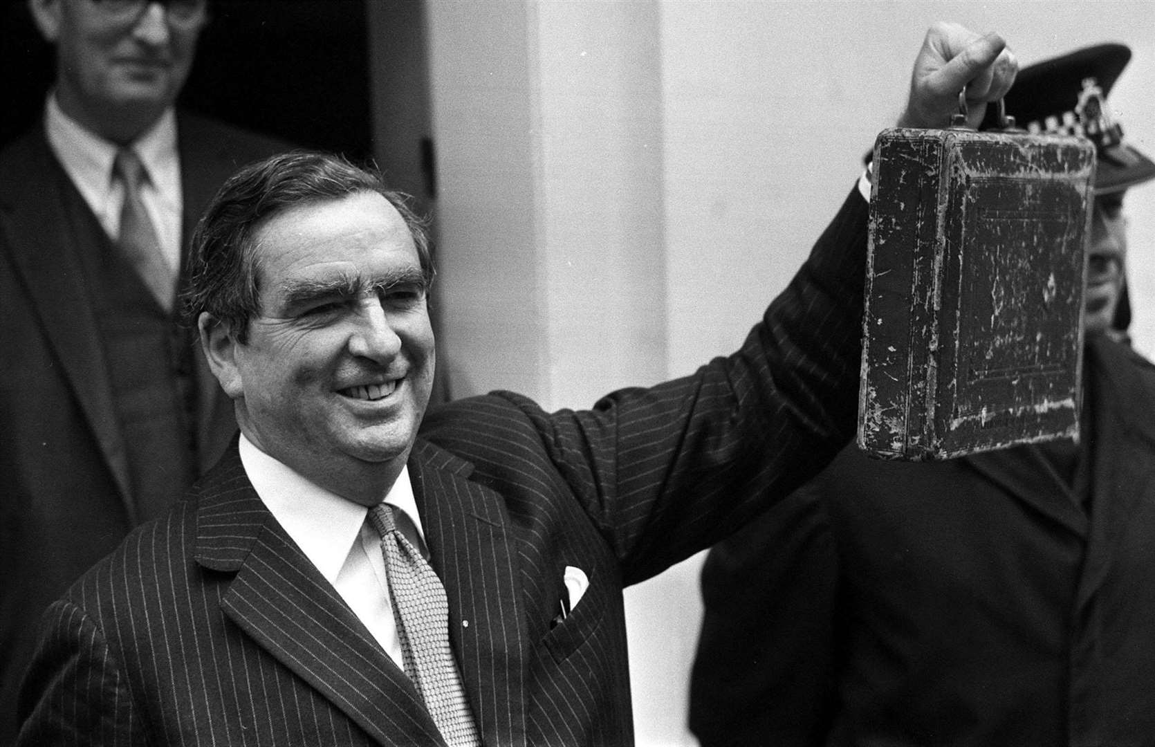 Chancellor of the exchequer Denis Healey leaves Downing Street to deliver his Budget speech in March 1974 (PA)