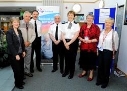 Representatives from agencies who have been working together to educate the elderly on how to stay safe