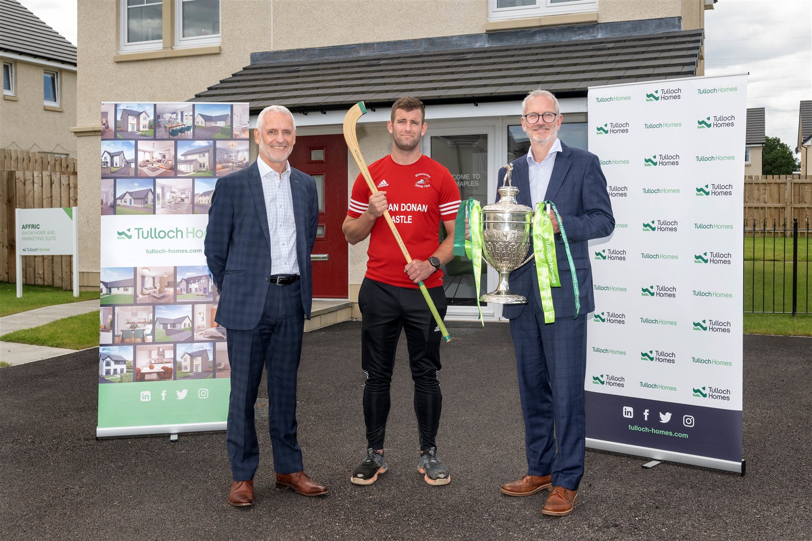 Sandy Grant, Managing Director, Tulloch Homes, John MacRae (Kinlochshiel forward) and Innes Smith,CEO, Springfield Properties, at the draw. Picture: Neil Paterson.