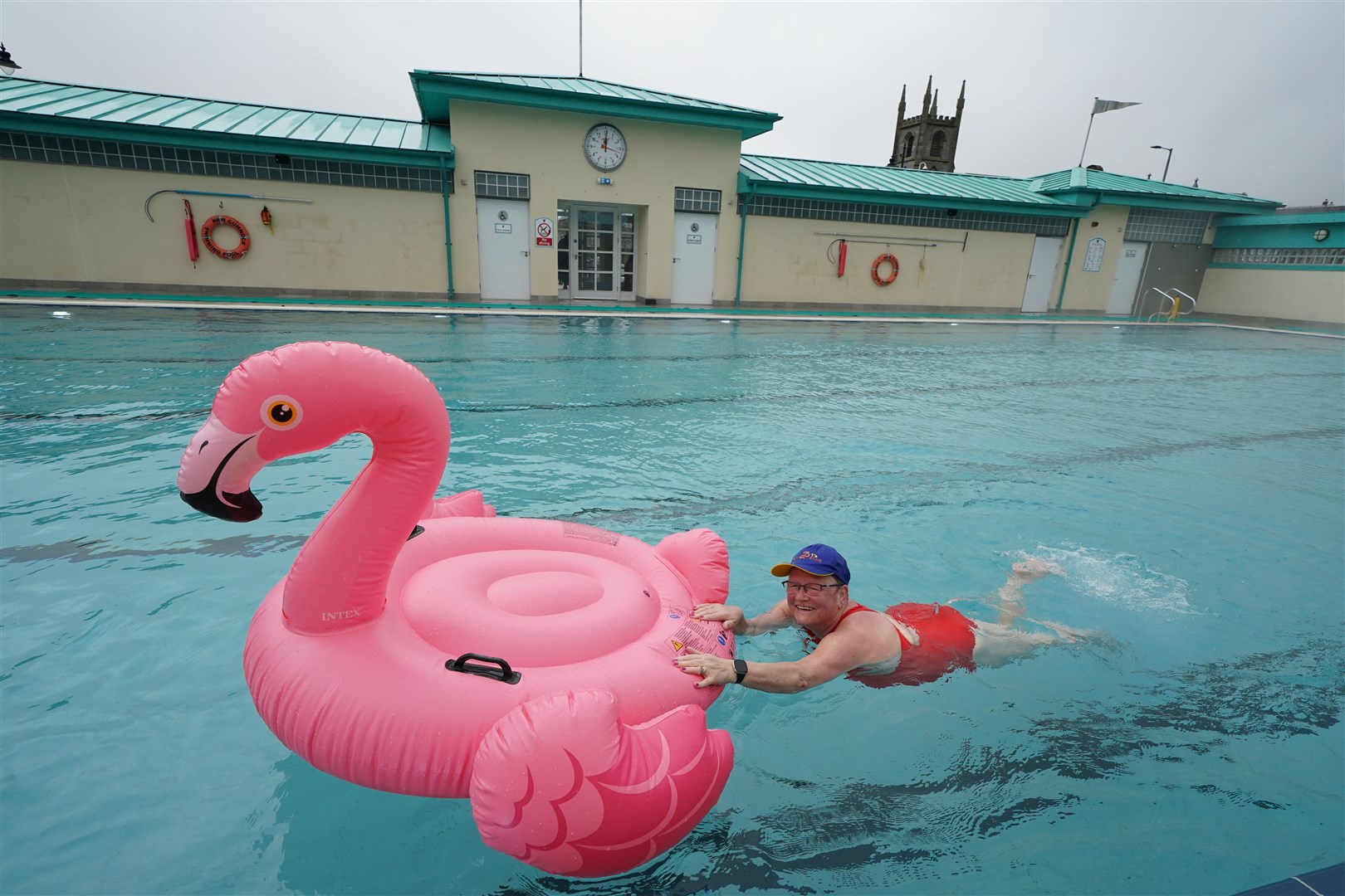 Pool manager Margaret Holden took her flamingo inflatable with her for the reopening (Andrew Milligan/PA)