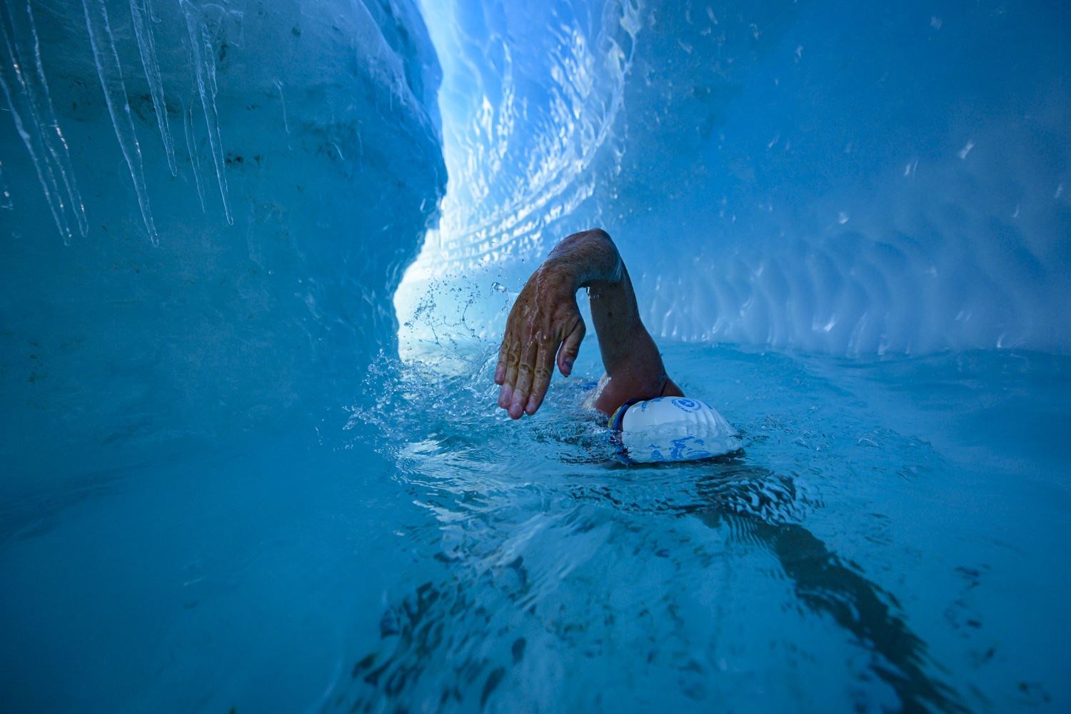 Briton Lewis Pugh became the first person to swim under an Antarctic ice sheet (Lewis Pugh/PA)