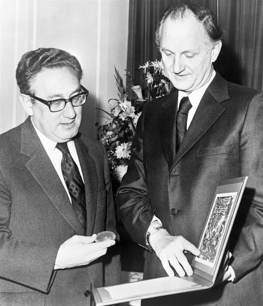 Mr Kissinger receiving his Nobel Peace Prize at Claridge’s Hotel in London (PA)