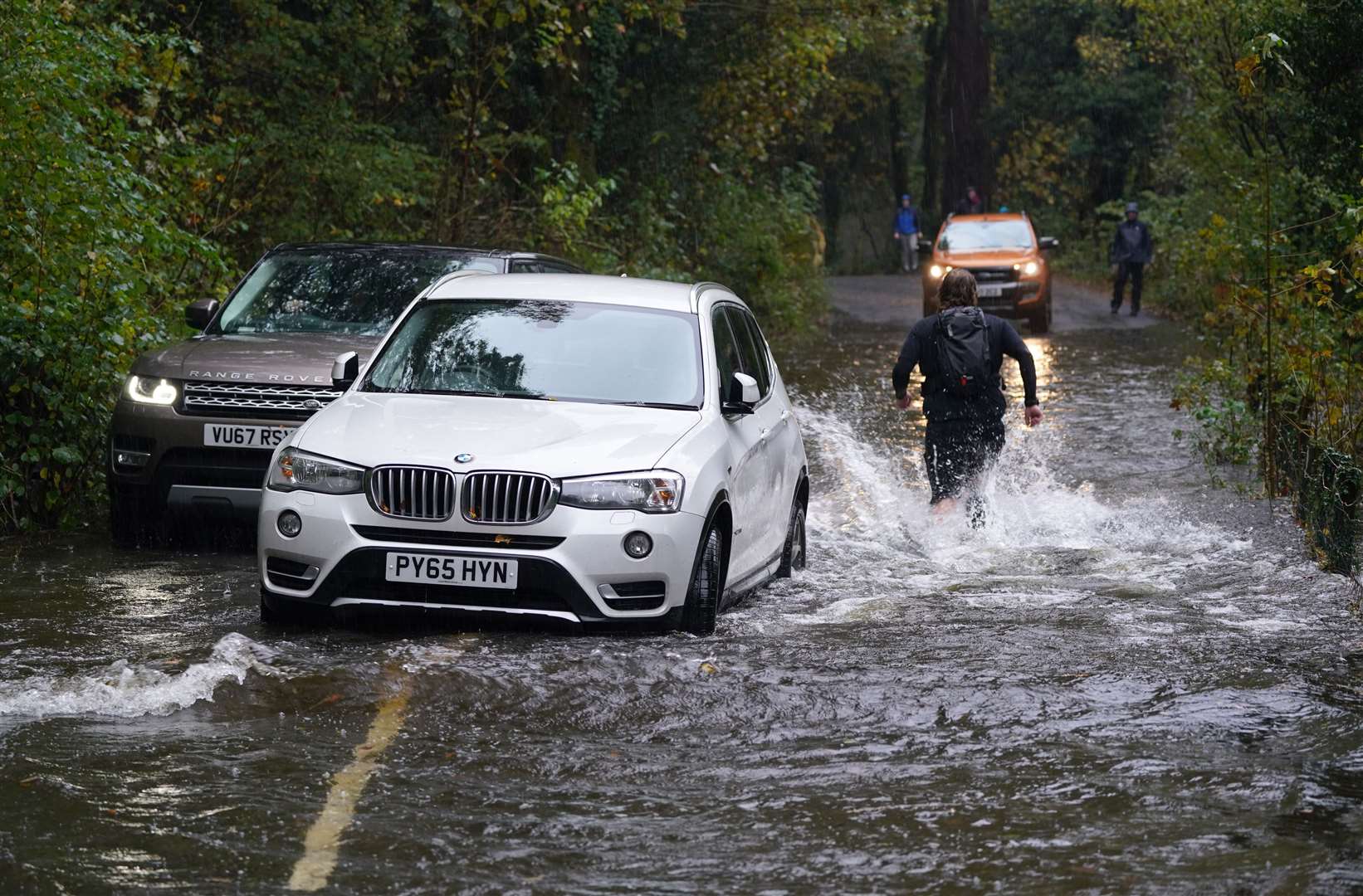 A broken down car in floodwater near Derwentwater, Keswick, in Cumbria (Owen Humphreys/PA)