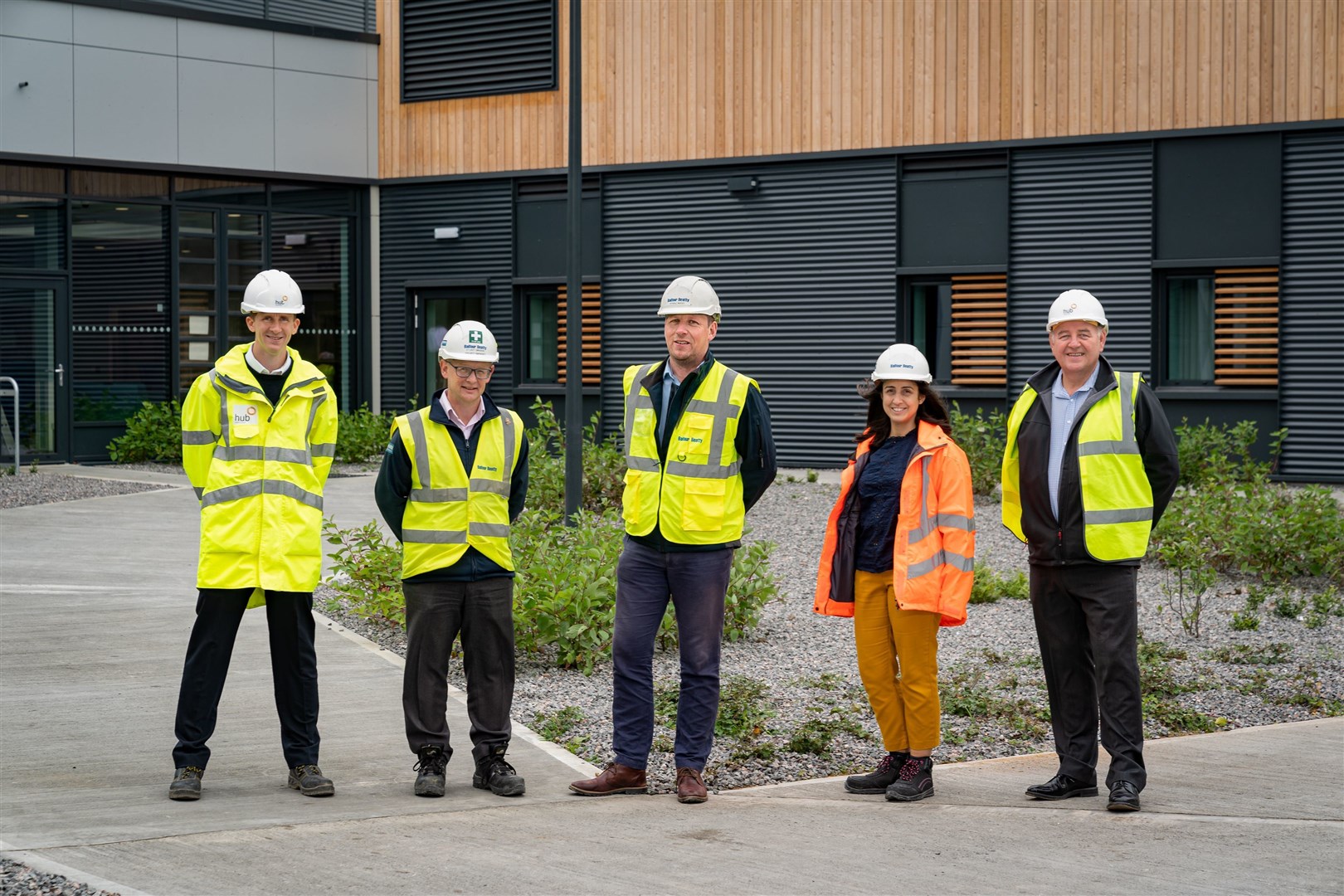 Outside the new hospital are Scott Adams, project manager, hub North Scotland; Stuart Danskin, senior project manager, Balfour Beatty; Atholl McKay, operations manager, Balfour Beatty; Heather Cameron, senior project manager, NHS Highland; and Peter Ramsay, project director, hub North Scotland. Photo: Paul Masson.