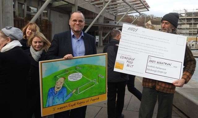 Andy Wightman (centre, left) pictured at a planning rights protest in 2018