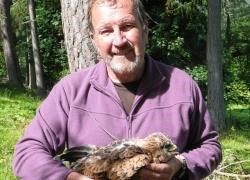 Brian Etheridge with red kite fledgling.