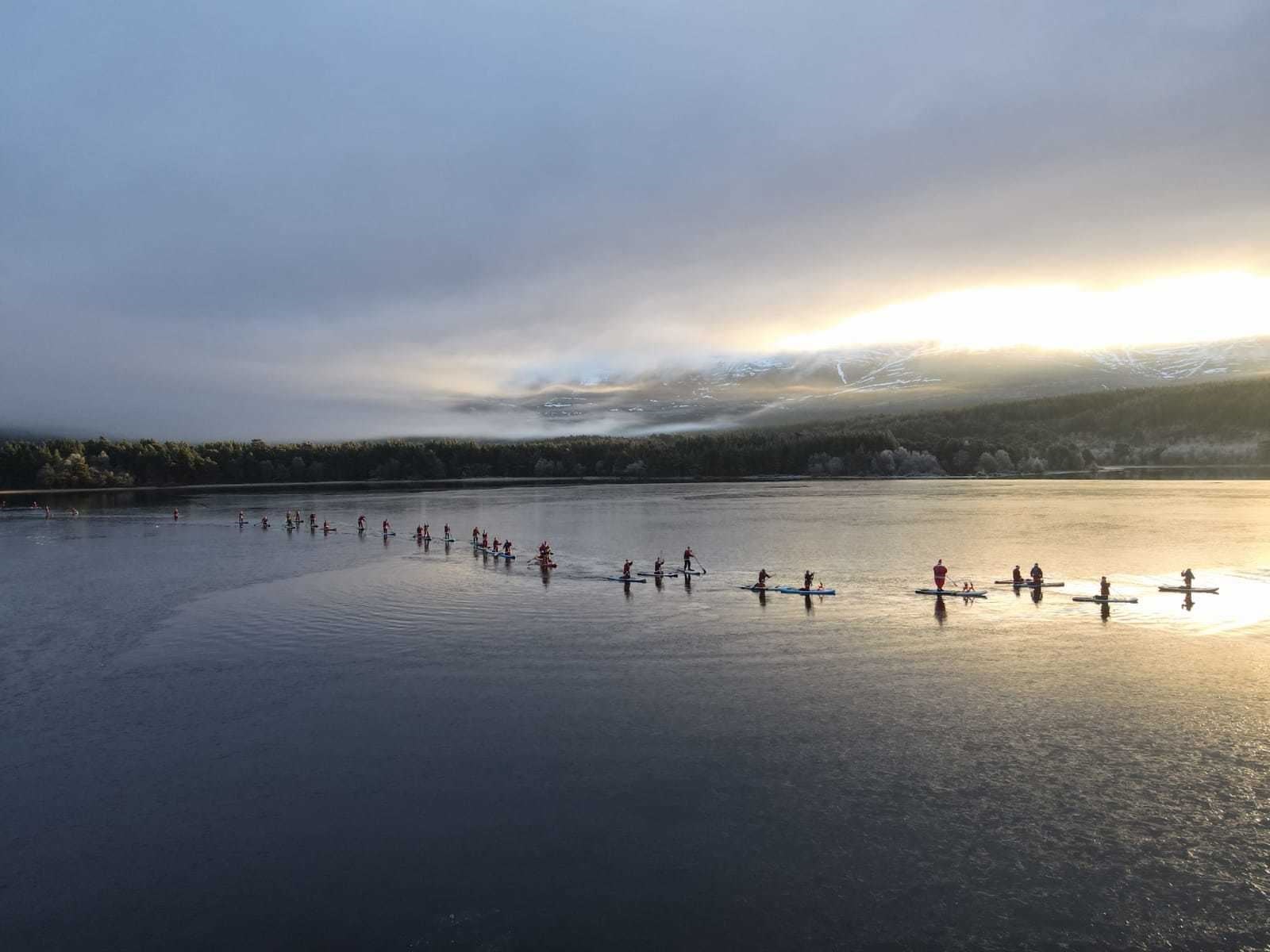 SEA OF SANTAS: Photographer Neil Wilson captured the great paddleboard parade.