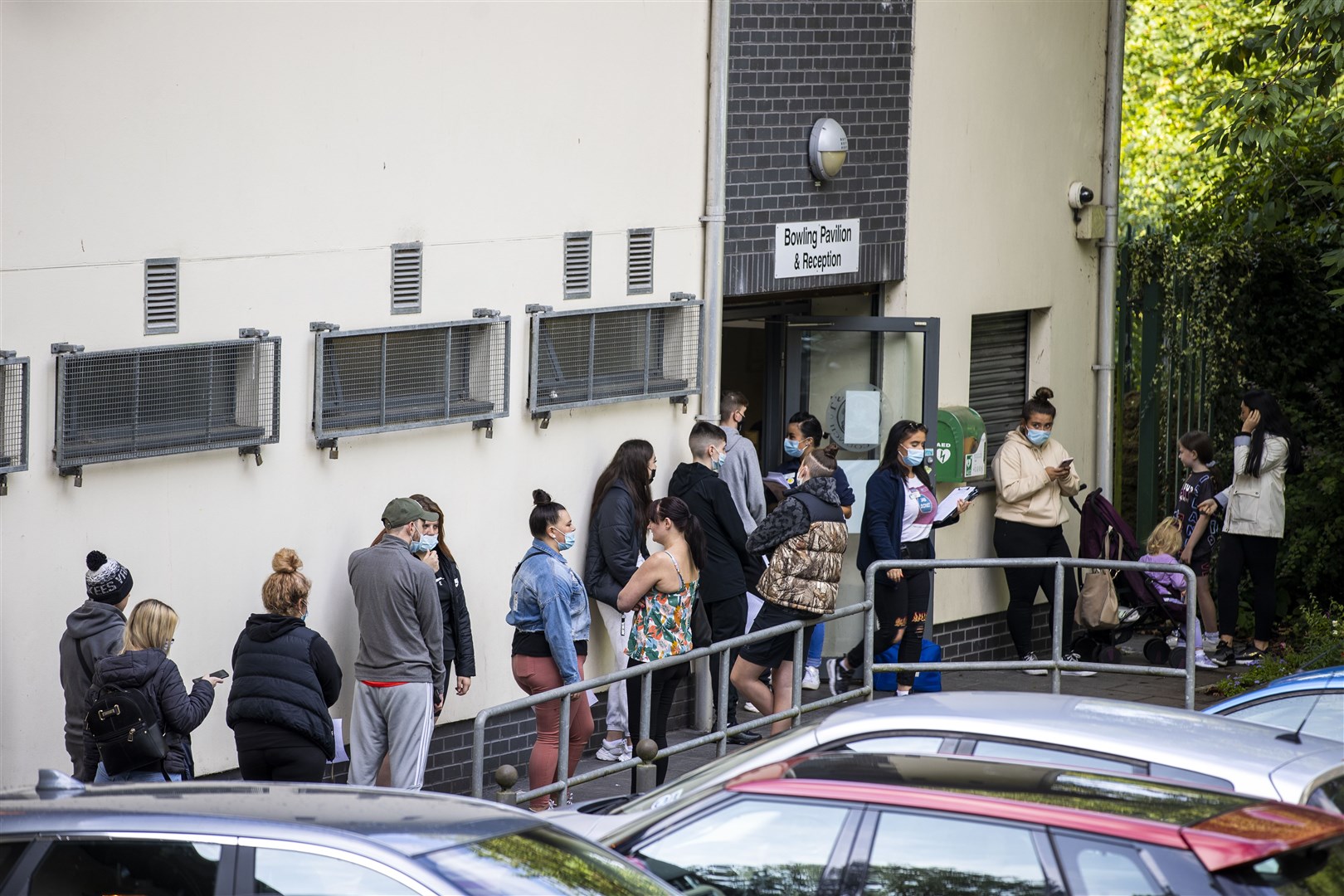 Festival goers at Feile an Phobail queuing to receive their first vaccination (Liam McBurney/PA)