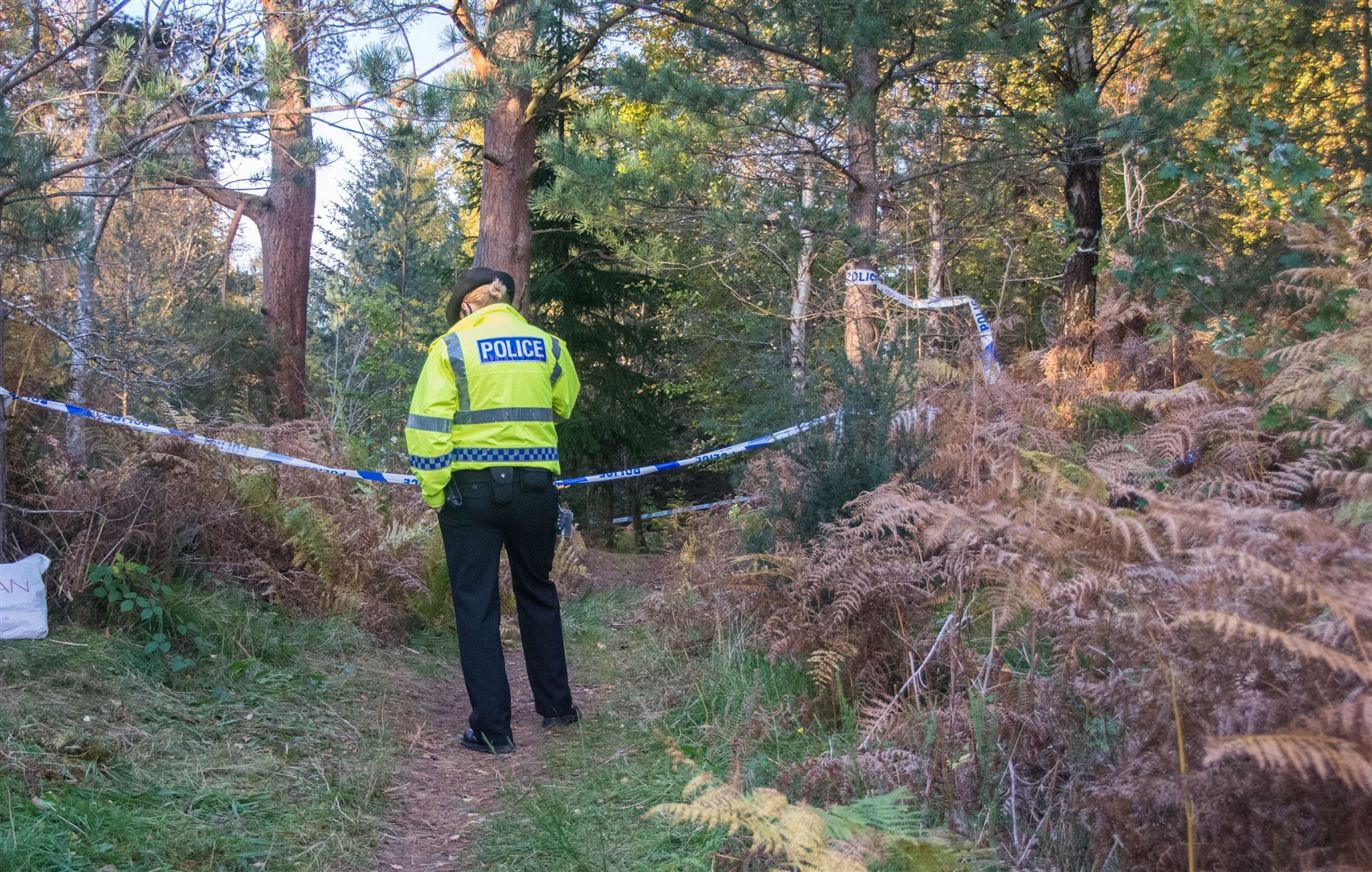 A police officer at the scene after the attacks at Birkenhill Woods, south of Elgin, on October 21 last year.