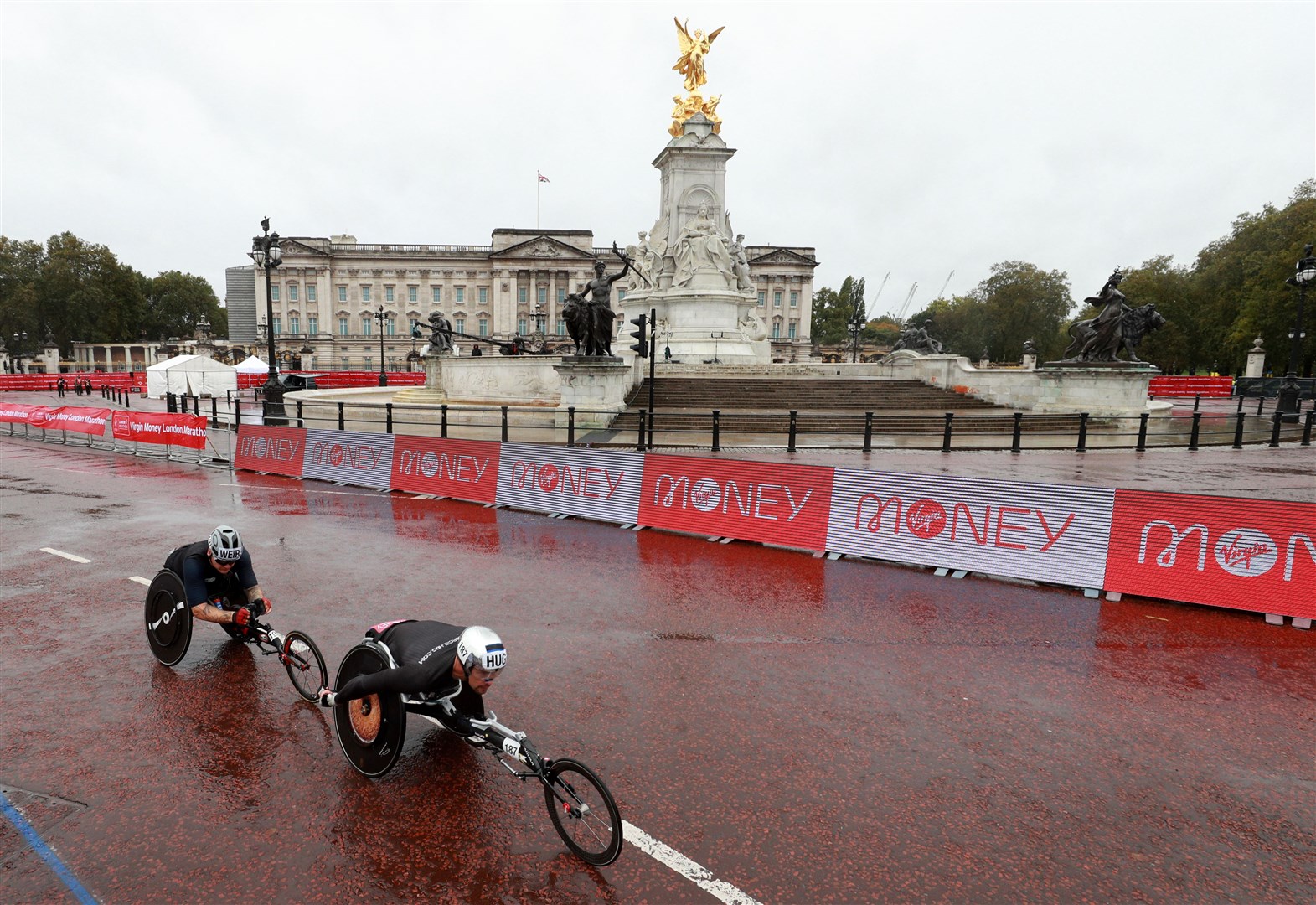 Great Britain’s David Weir and Switzerland’s Marcel Hug race near St James’ Park (Ian Walton/PA)