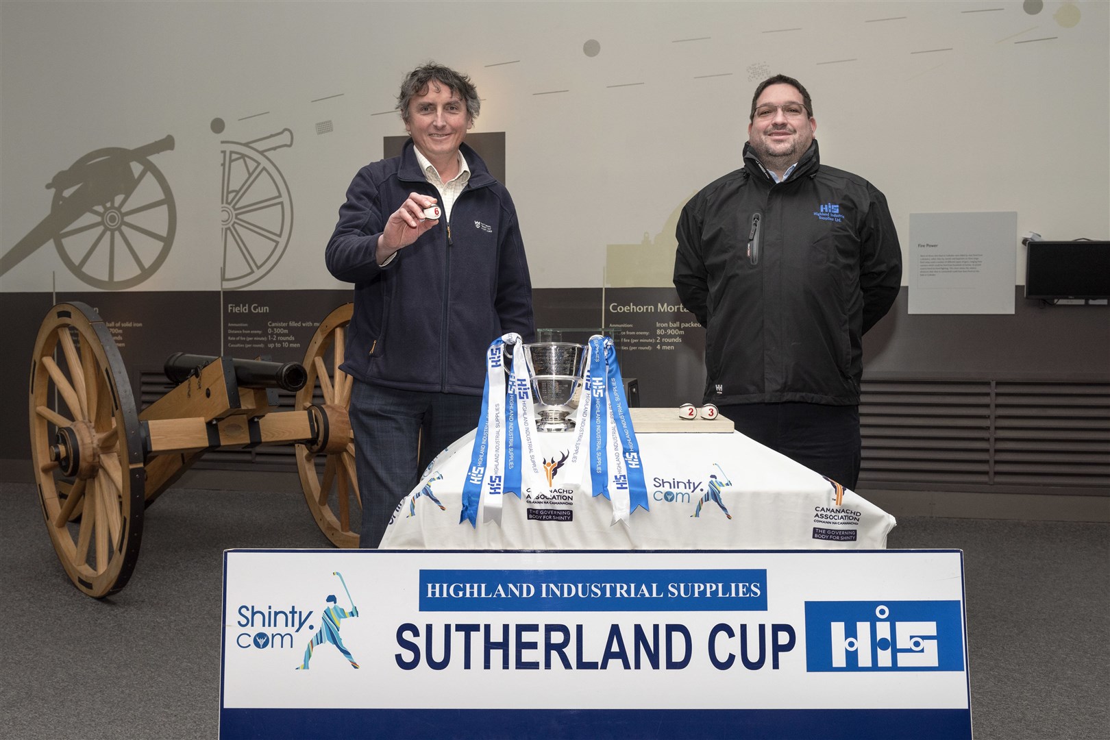 Raoul Curtis-Machin (left) of Culloden Battlefield, and Garry Mackintosh, Director of Highland Industrial Supplies, draw the balls in the HIS Sutherland Cup at Culloden Battlefield Visitor Centre. Picture: Neil G Paterson.