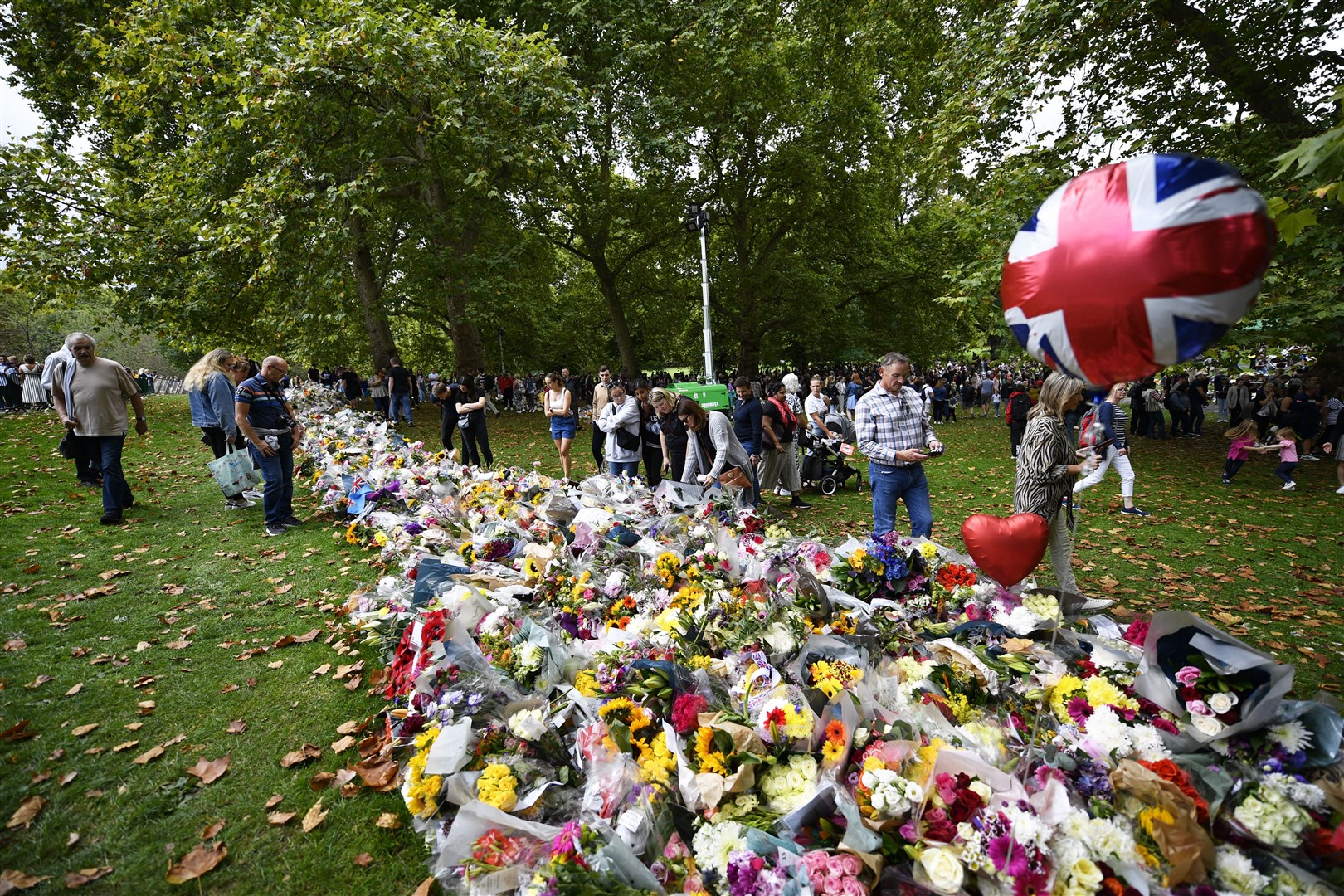 A bank of floral tributes in Green Park next to Buckingham Palace (Beresford Hodge/PA)