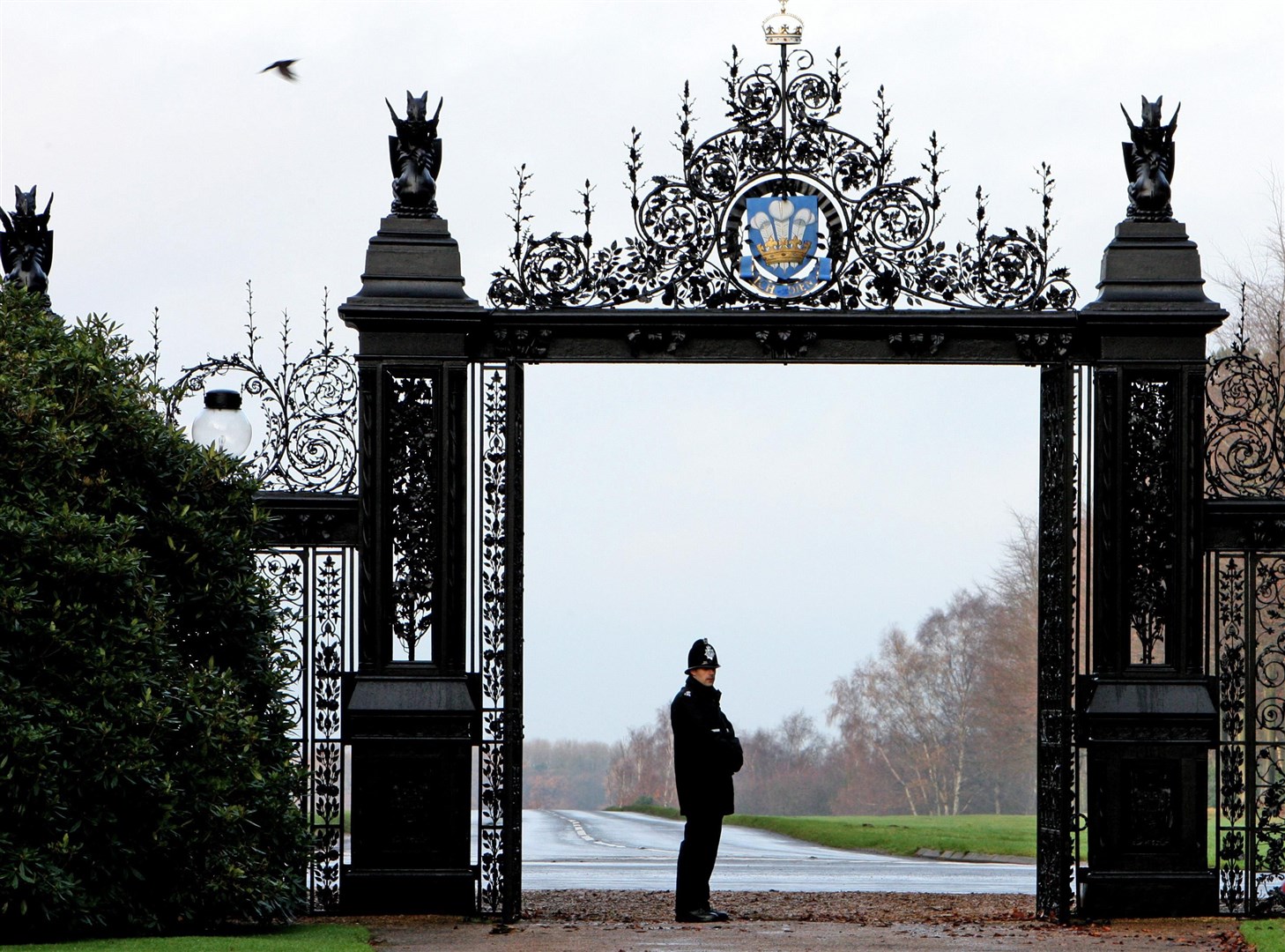 A police officer at the gates to Sandringham House (Chris Radburn/PA)