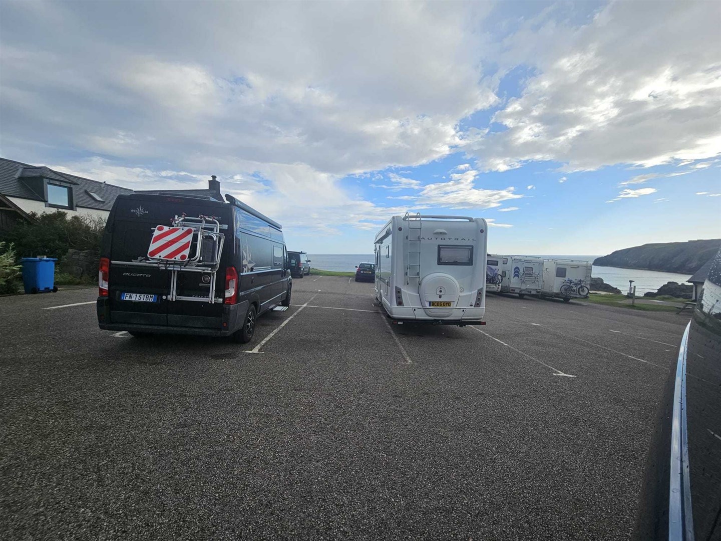 This picture shows motorhomes parked in Durness Car Park.