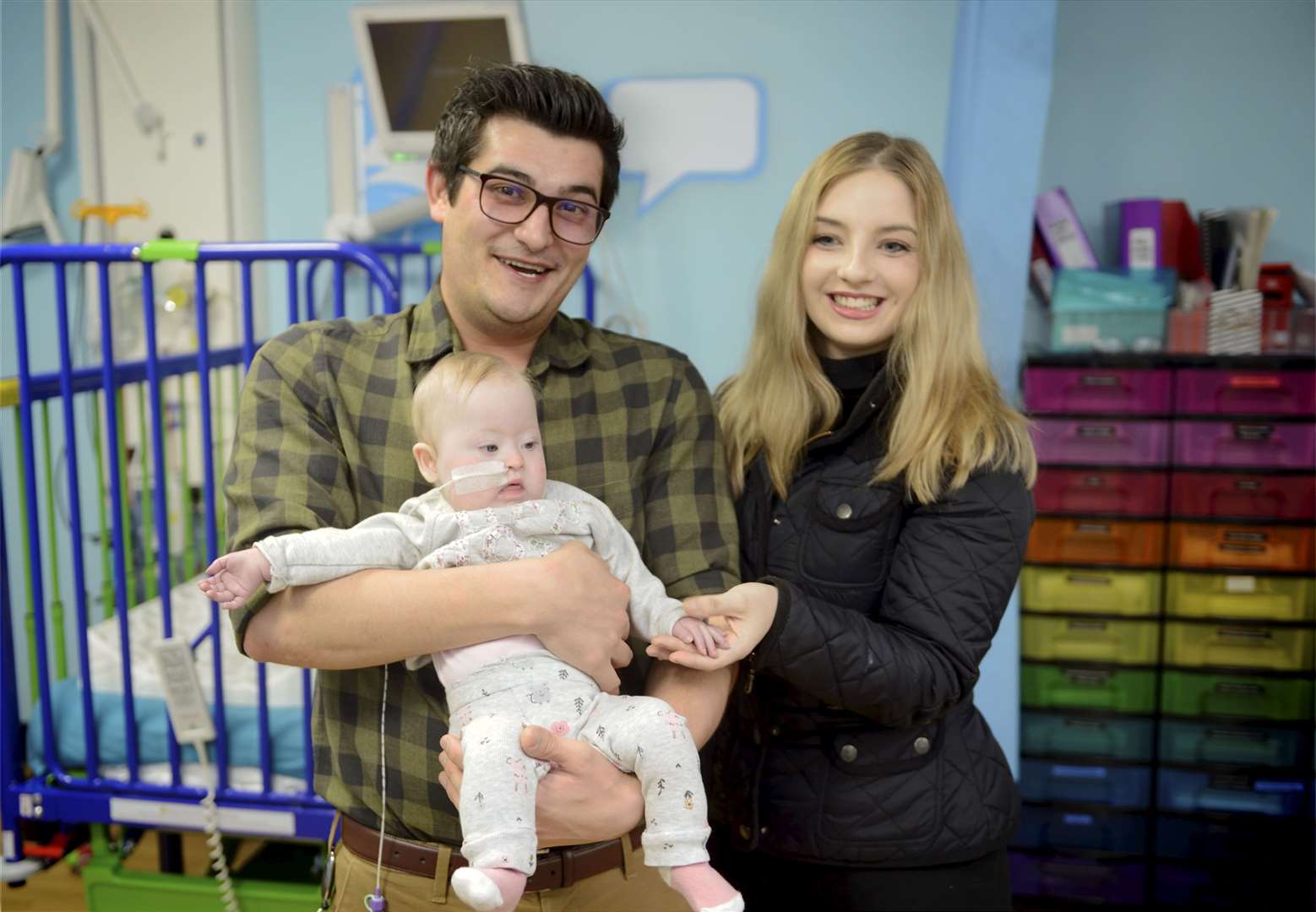 Dr Ryan Coetzee of the Raigmore Hospital children's unit was a big hit onlne after a video of him singing to one of his baby patients went viral..Dr Ryan Coetzee singing to baby Gracey Wemyss and her mum, Shannon Wemyss..Picture: James MacKenzie..