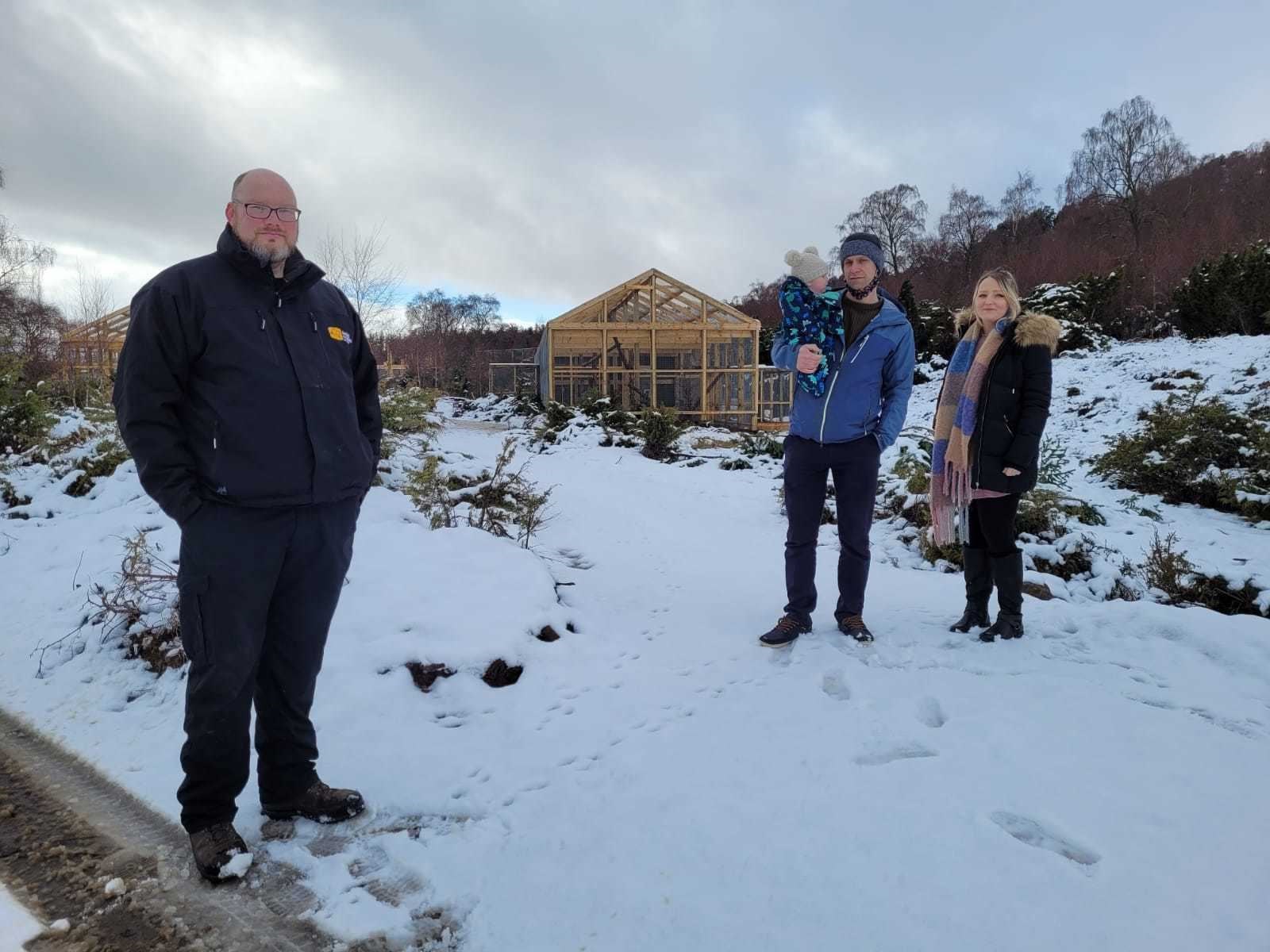Peter Macnab and his family on a visit to the Highland Wildlife Park when they handed over the cheque to David Barclay (left).