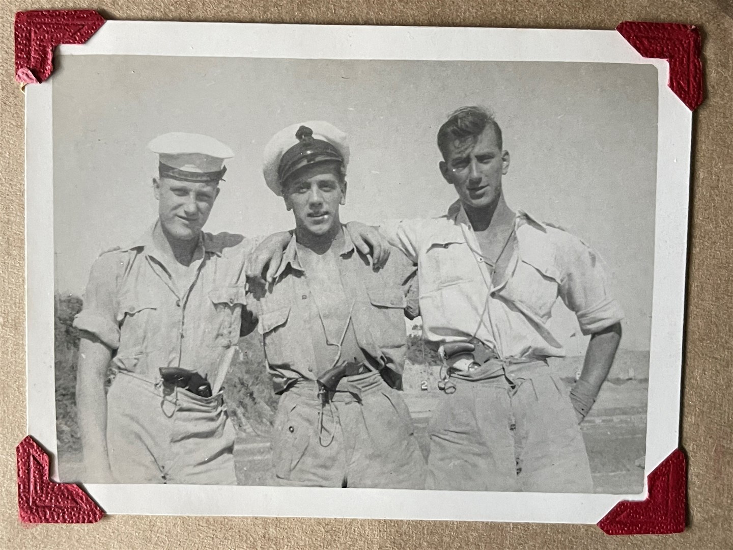 Able Seaman John Davis (far right) and fellow his servicemen (Henry Aldridge and Sons/PA)