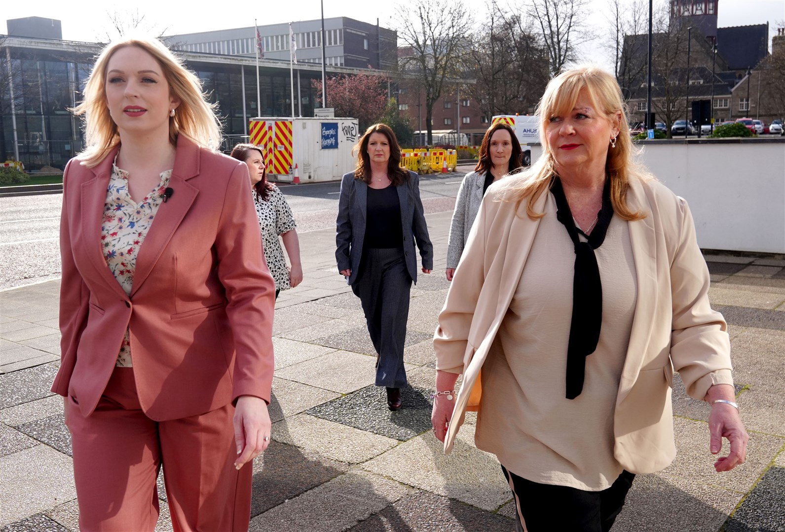 Bethany Hutchison (left) and Lisa Lockey (right) lead the group of nurses from Darlington Memorial Hospital as they arrive at the employment tribunal hearing in Newcastle (Owen Humphreys/PA)