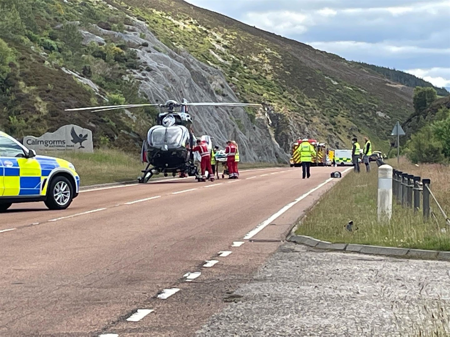 Crash casualties are stretchered to the waiting air ambulance