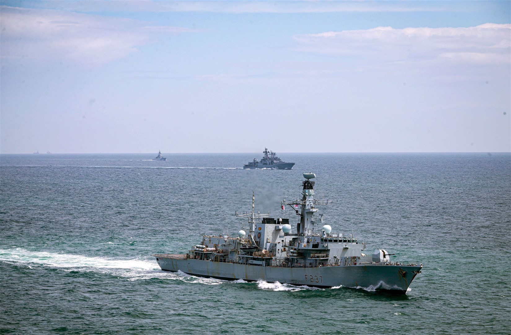 HMS Westminster (nearest the camera) and patrol vessel HMS Tyne (furthest from camera), as they escort Russian warship Vice Admiral Kulakov through the English Channel in June (MoD/PA)