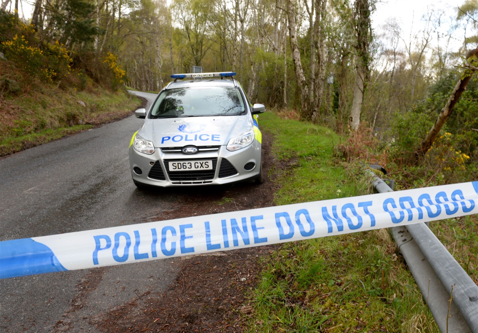 The B862 was closed after fire on property above Dores. Picture: Gary Anthony