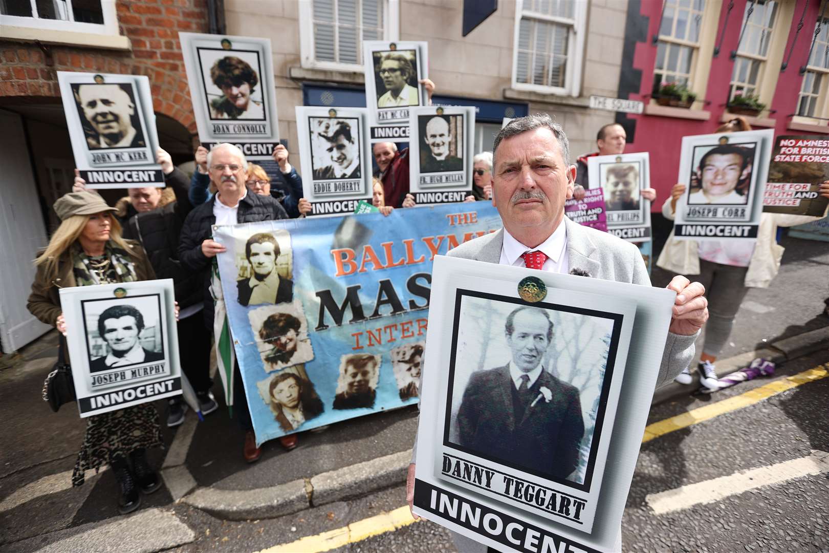 John Teggart, son of victim Daniel Teggart, demonstrating with some of the families of the 11 people killed by soldiers in Ballymurphy in west Belfast in 1971, outside Hillsborough Castle (Liam McBurney/PA)