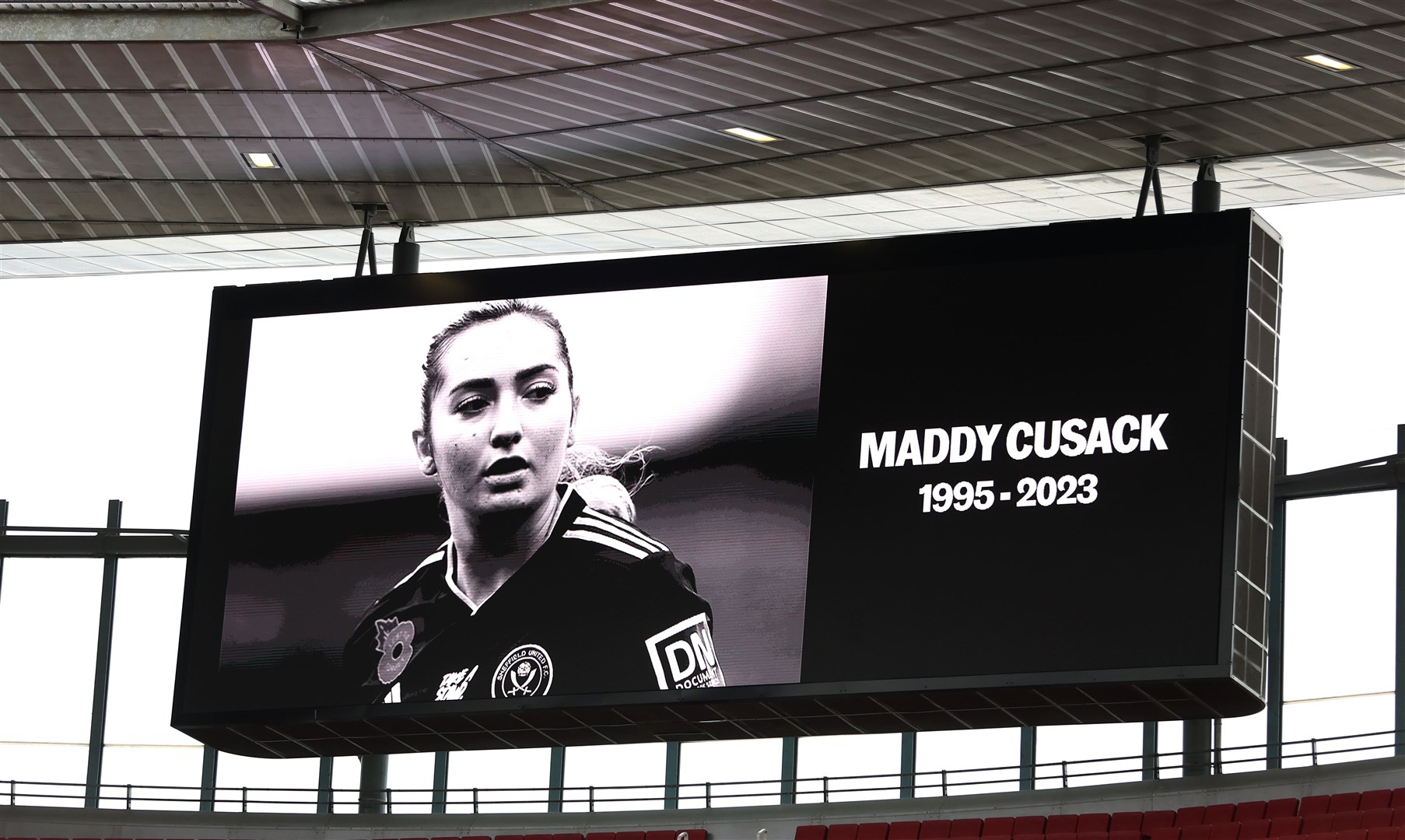 A tribute to Sheffield United player Maddy Cusack is shown on the big screen during the Barclays Women’s Super League match at Emirates Stadium, London (Steven Paston/PA)