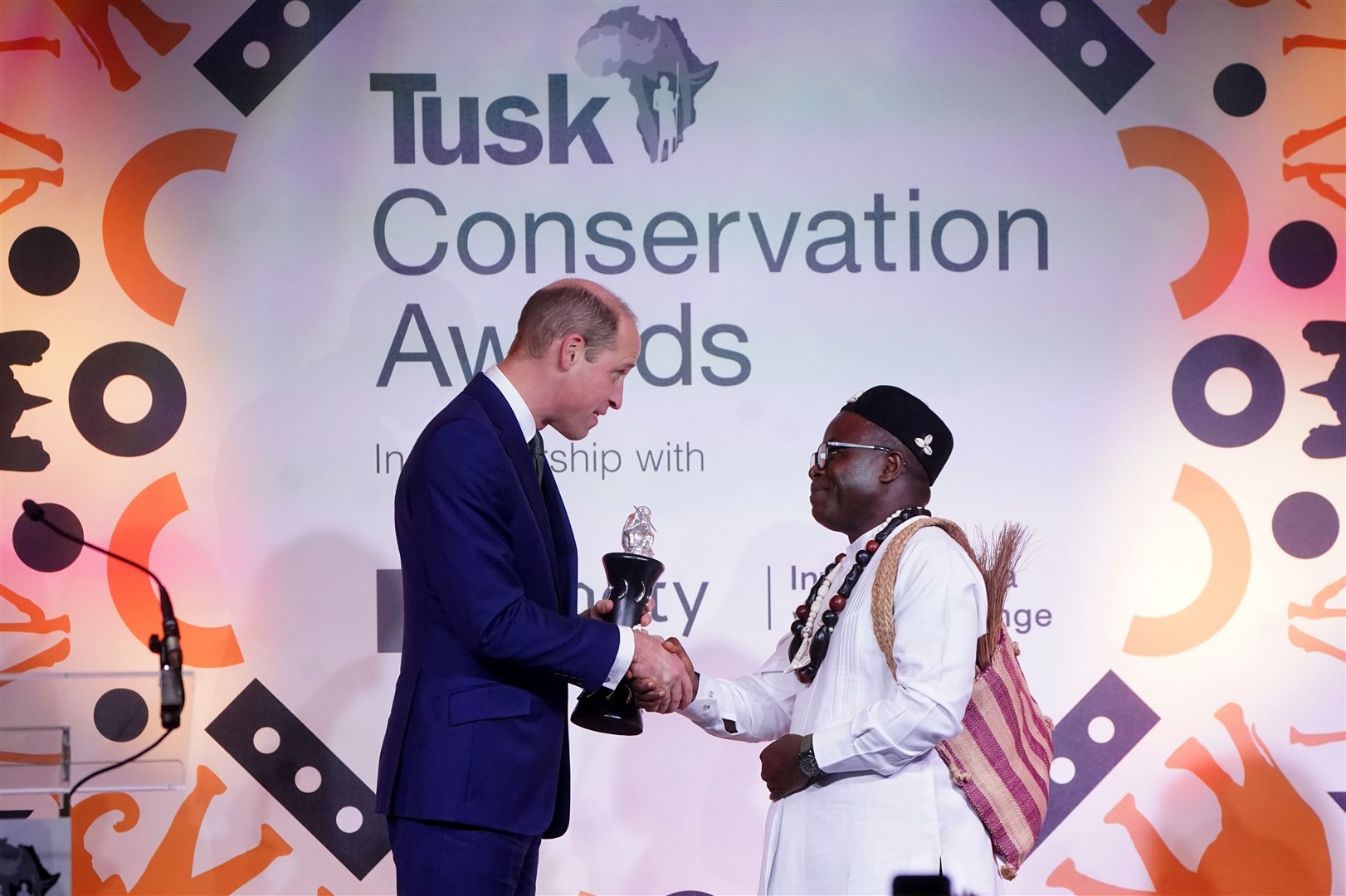 William presents Dr Ekwoge Abwe, from Cameron, with the Prince William Award for Conservation in Africa (Victoria Jones/PA)