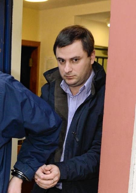 Munro is led away to start his jail term