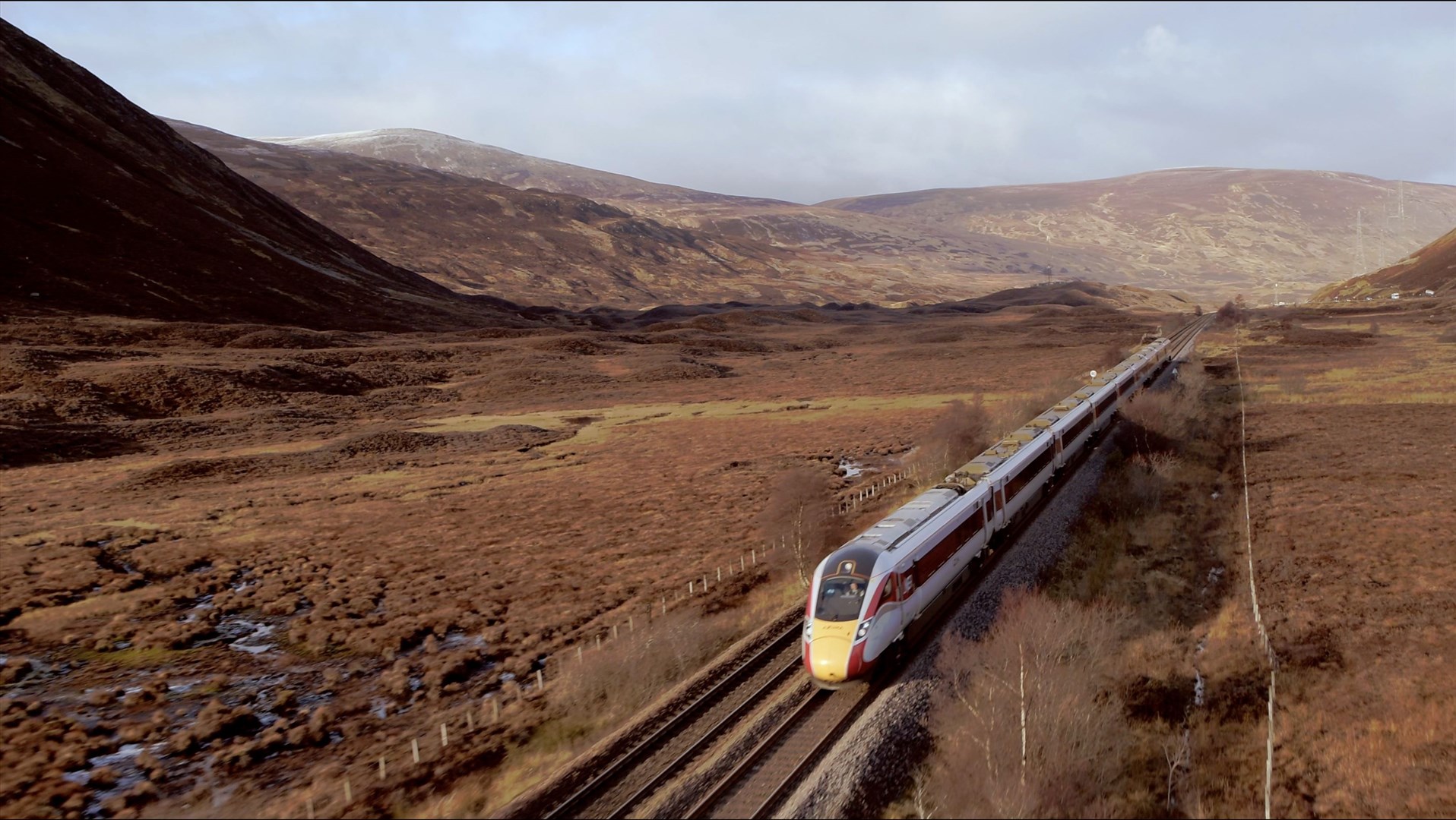 An LNER Azuma train crosses Drumochter on the Highland Main Line.